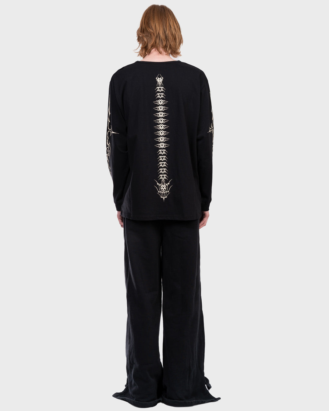 Tattoo Spine Longsleeve T-Shirt in Black. Back angle.