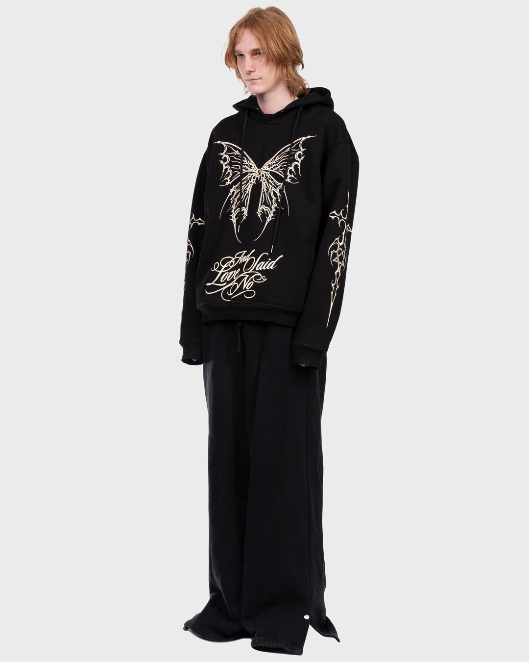 Tattoo All-Over Print Hoodie in Black. Side Angle.